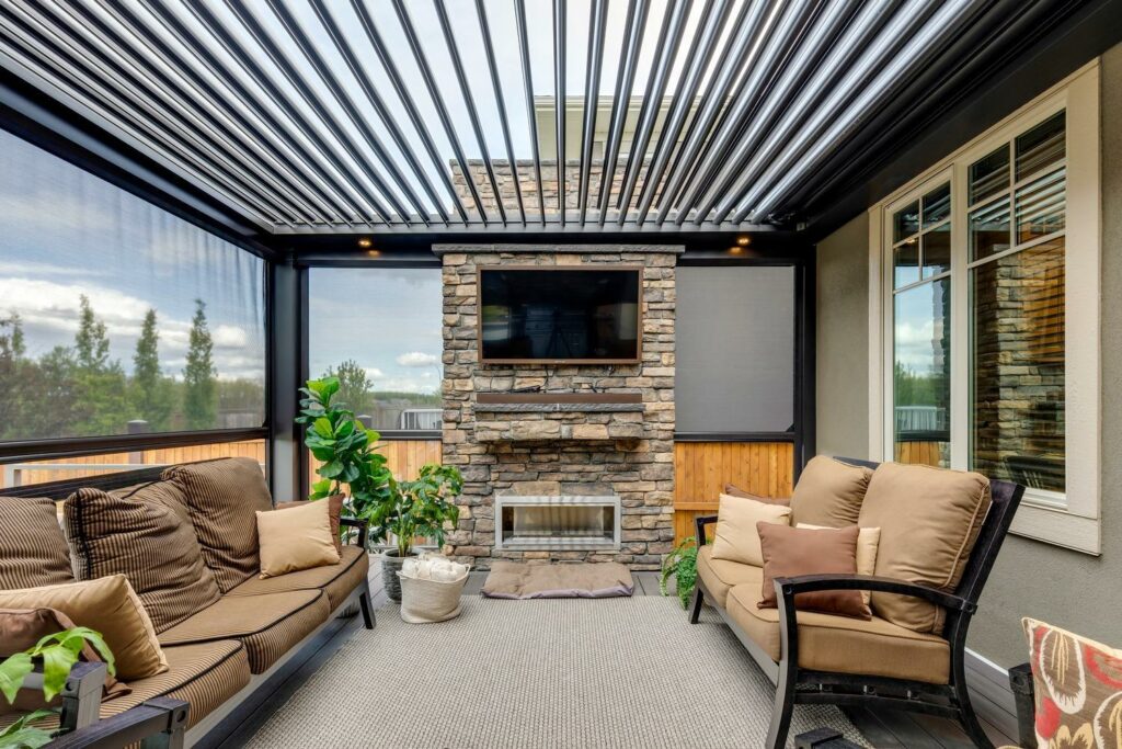 photo of a StruXure NorCal motorized pergola with louvers, outdoor furniture, and an outdoor fireplace in Alamo photo