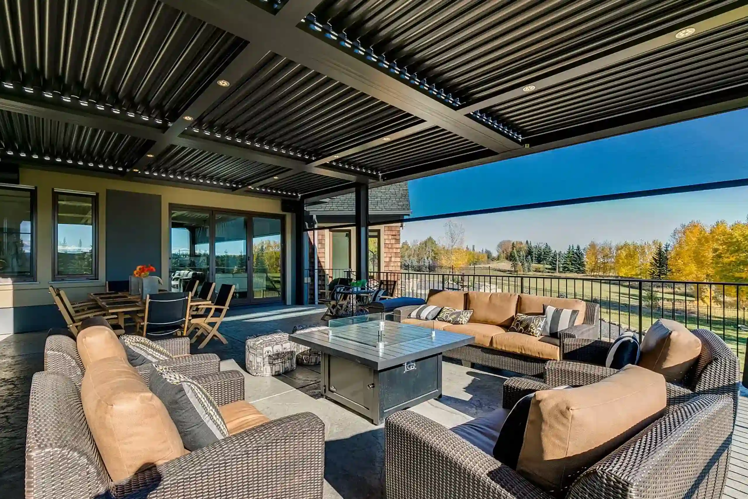 Photo of a StruXure pergola providing shade over an outdoor living room.