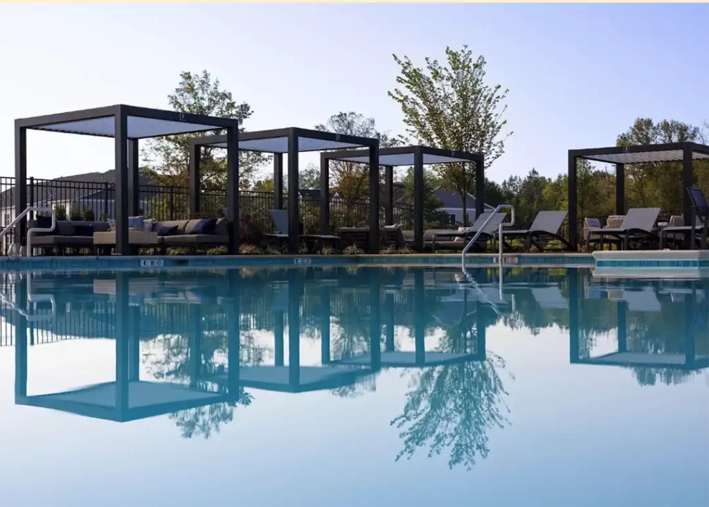 Photo of a series of Cabana X structures poolside.