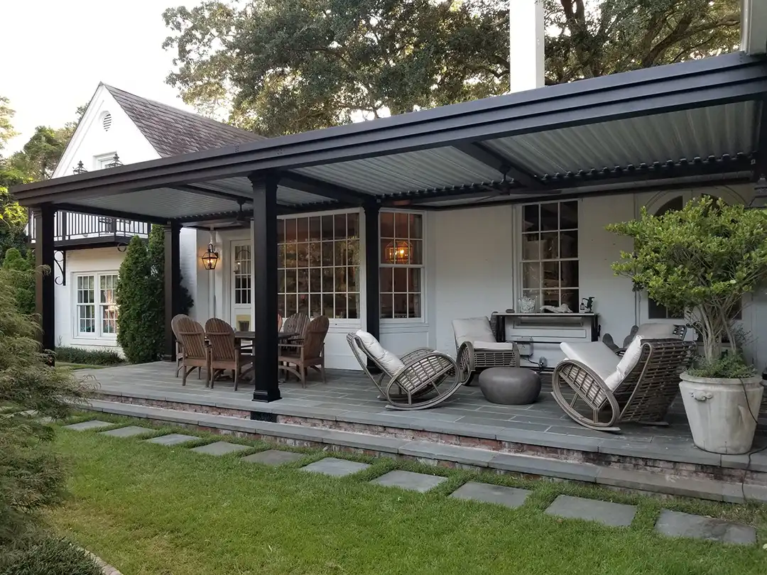 Photo of a StruXure pergola providing cover for a patio with outdoor furniture.