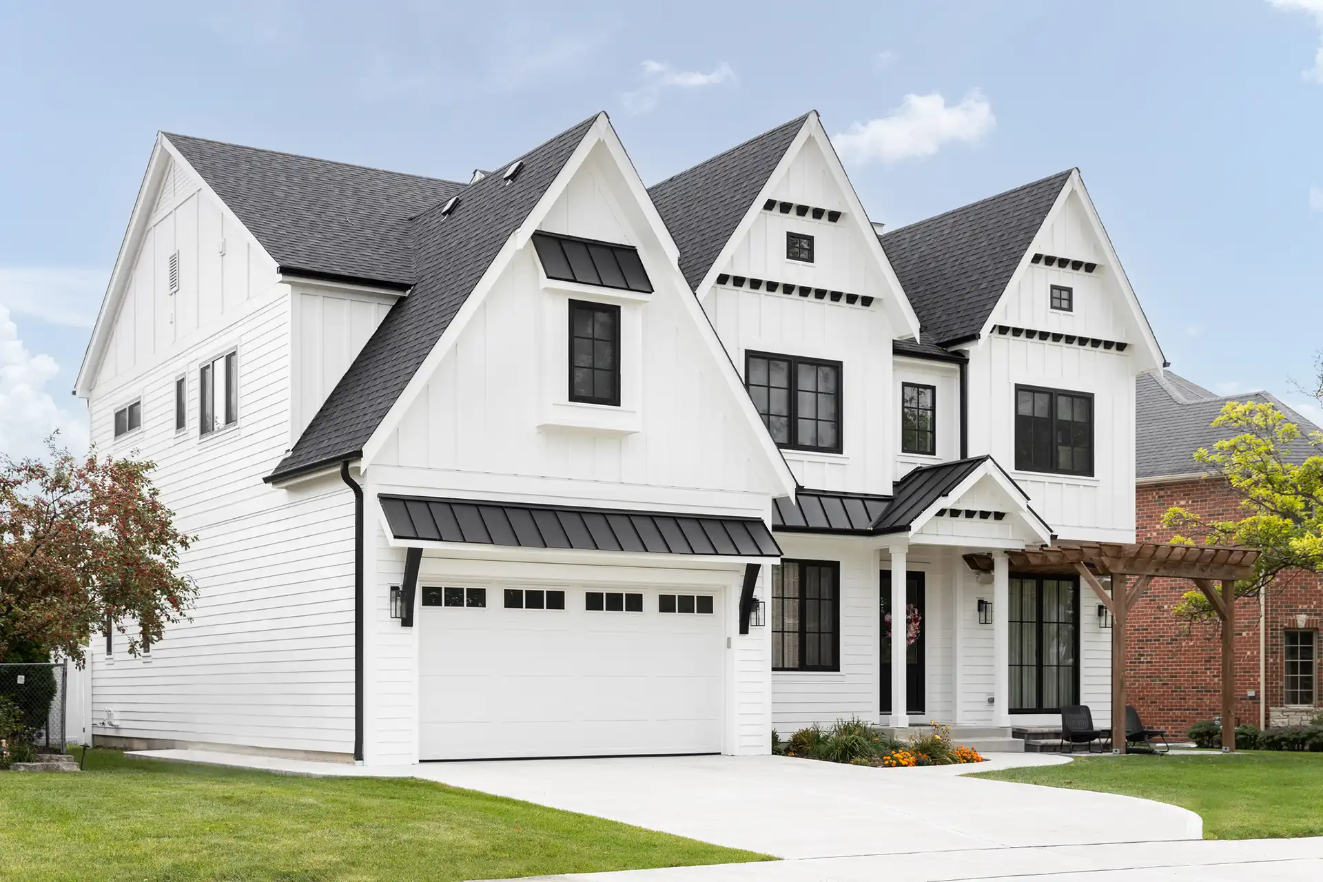 Photo of home with small garage awning