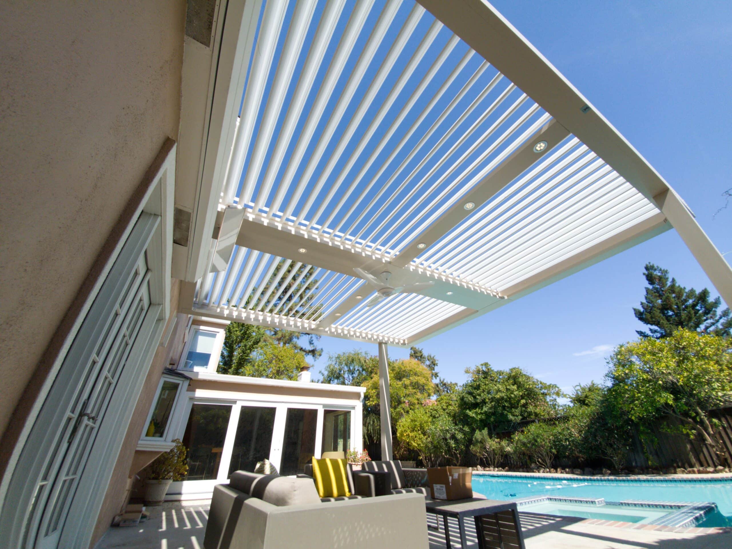 white StruXure motorized pergola by a poolside - Struxure motorized pergolas in California