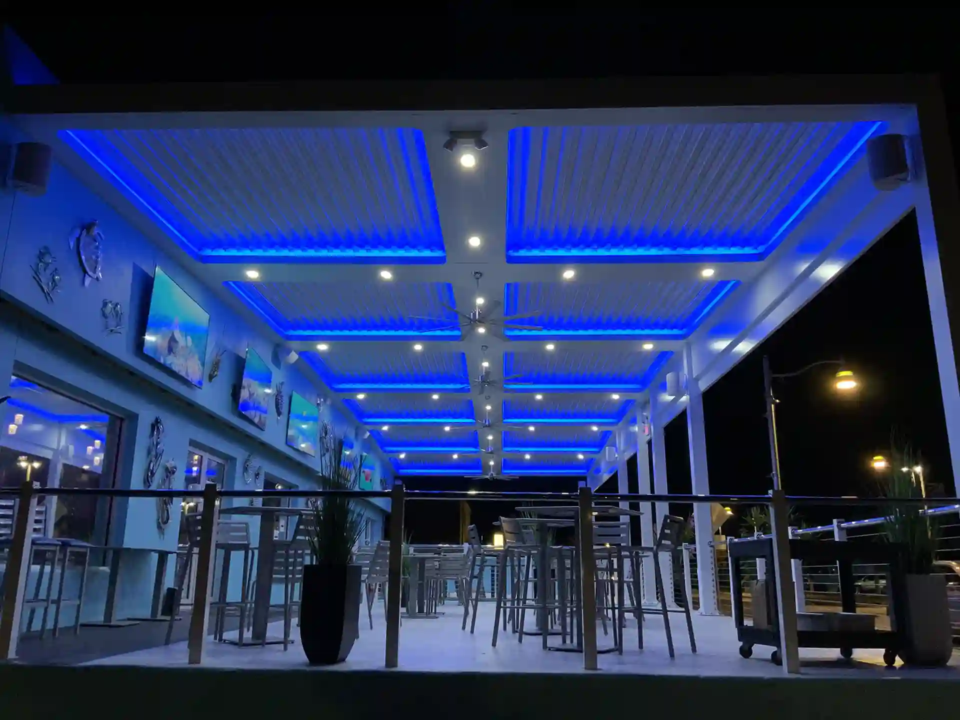 photo of a StruXure pergola in a commercial application with ceiling fans and lights
