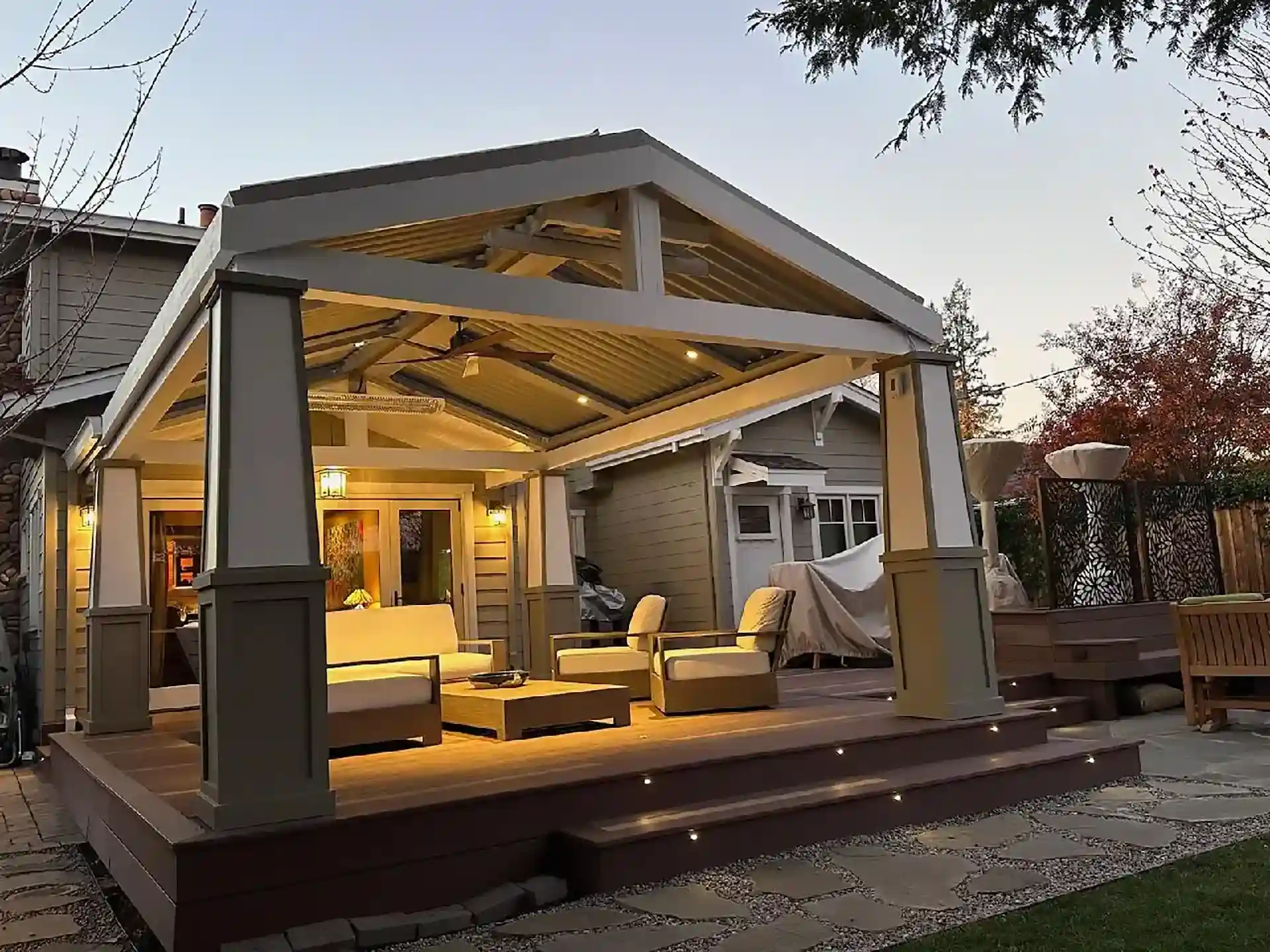 Photo of a pergola on a raised deck with lighting, ceiling fan, and heater